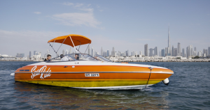 orange color boat on the ocean in Dubai