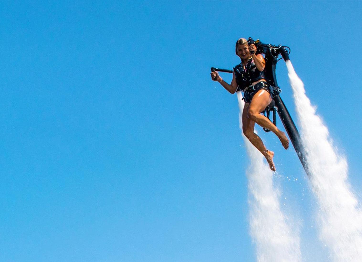 a female looking excited enjoying the jetpack ride in dubai