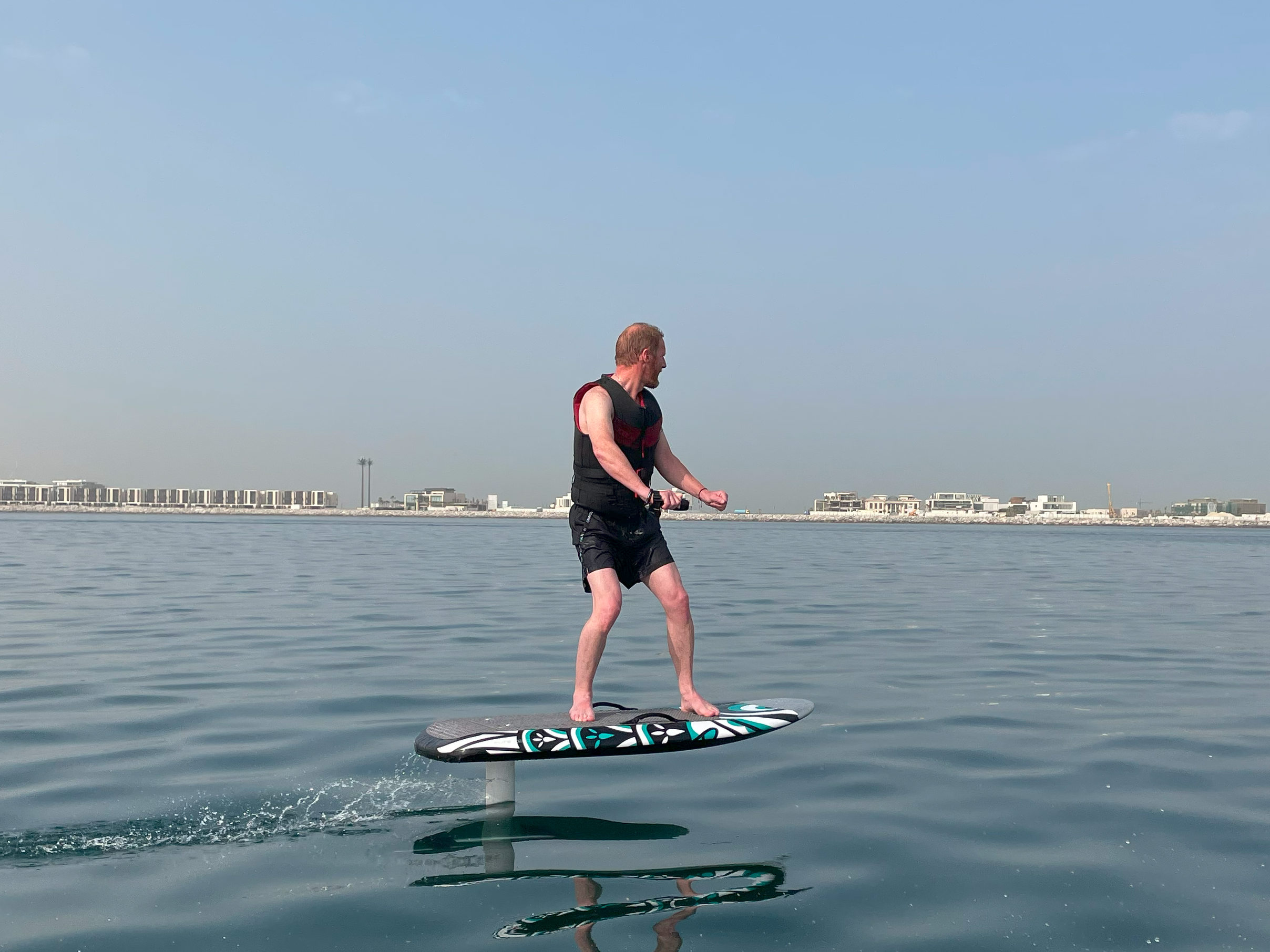 a man riding efoil in Dubai waters