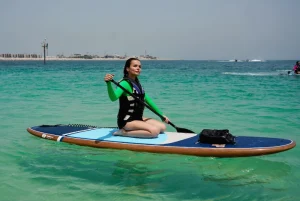 a girl enjoying sit down paddle board rental in dubai
