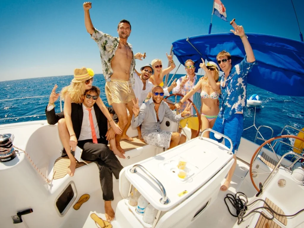 a bunch of men and women enjoying yacht rental dubai experience - a popular yachting culture