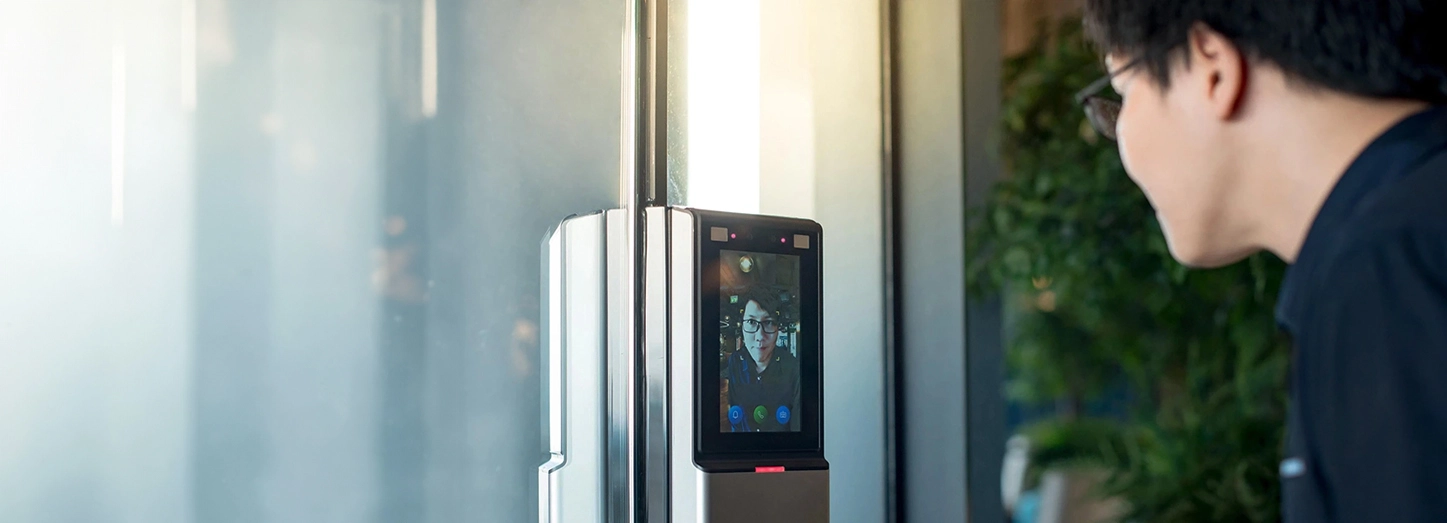 use of ai in travel & tourism industry. a man trying to check-in in a hotel using is face ID