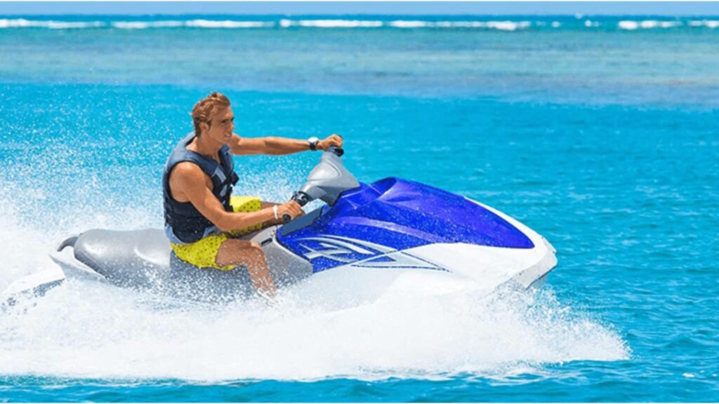 a man enjoying jet ski ride on a blue jet ski in miami, usa